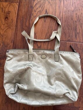 Coach Light greenMonogram Tote. Has signs of wear but can be cleaned.